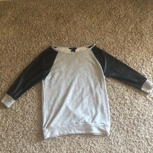 Gray sweater with leather sleeves